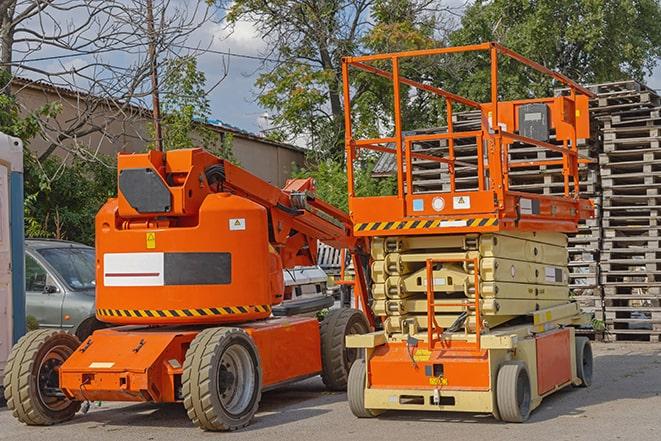 warehouse worker operating forklift to stack inventory in Logandale